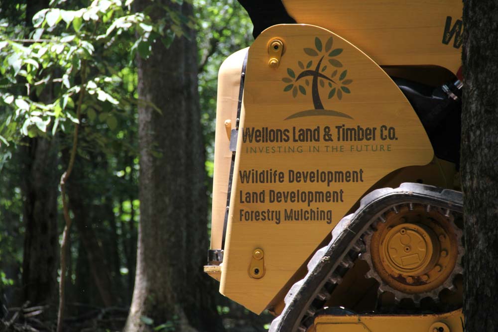 Wellons Land Recent Projects Bayou Meto Close Up Photo of Tractor with Motto